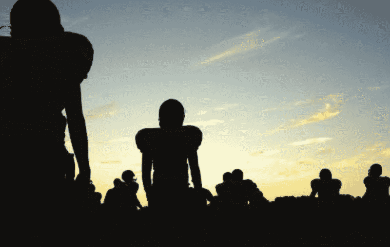 Concussions football field silhouette of players