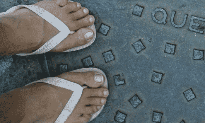 Feet with flip-flops on street