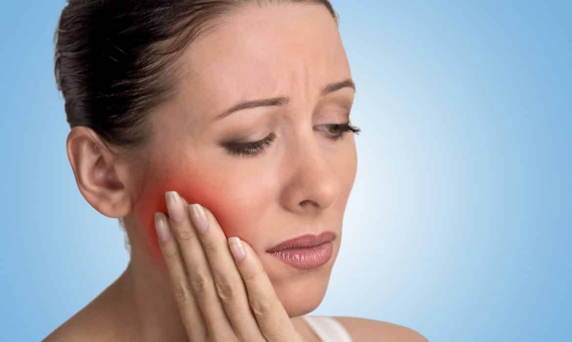 woman with gum pain