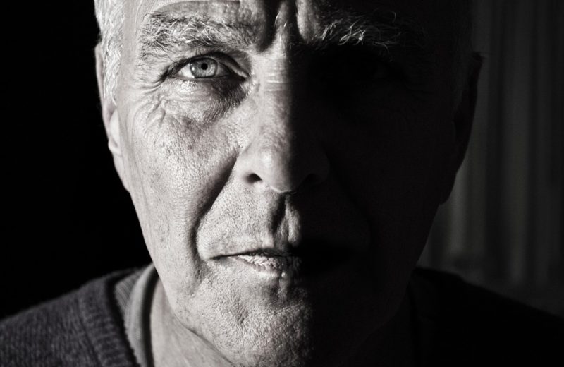 Prostate cancer screening based on individual circumstances: image is black and white and of older man looking right into camera