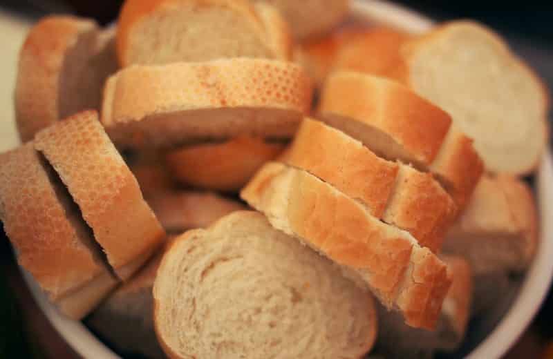 You can't prevent celiac disease. Image of bowl filled with slices of fresh baguette.