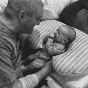 Marty hogan during treatment holding his son. photo courtesy of marty hogan