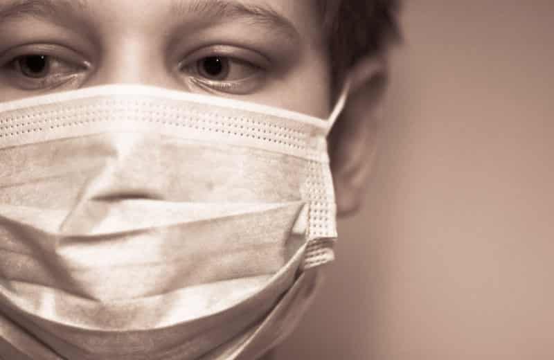 masked boy vaccine fear