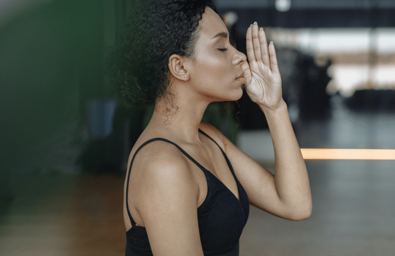 Woman practicing trauma-informed yoga