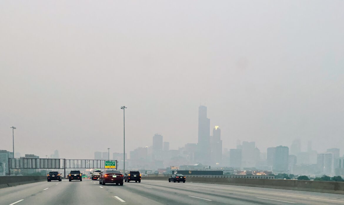 Looking north from the I-94 expressway toward Chicago, the skyline barely visible in a haze of wildfire smoke