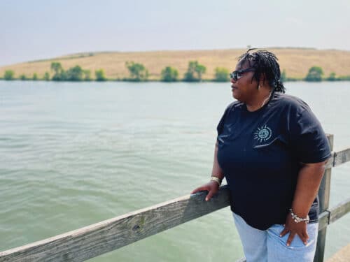 Activist and Altgeld Gardens resident Cheryl Johnson looks out on the Little Calumet River, where people fish on nice days, though Johnson questions the water’s safety.
