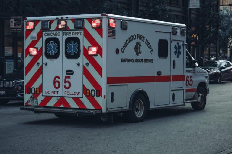 An ambulance drives down a street in Chicago.