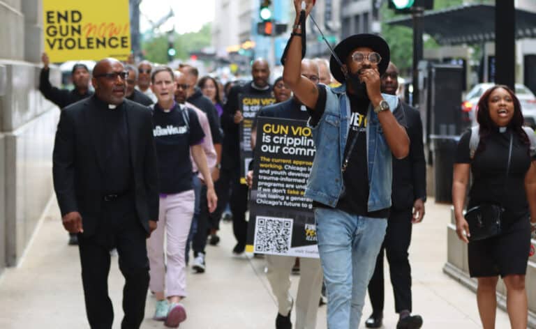 Rev. Ciera Bates-Chamberlain (pictured far right), and Live Free Illinois at a protest against gun violence. LiveFree Illinois is a faith based organization