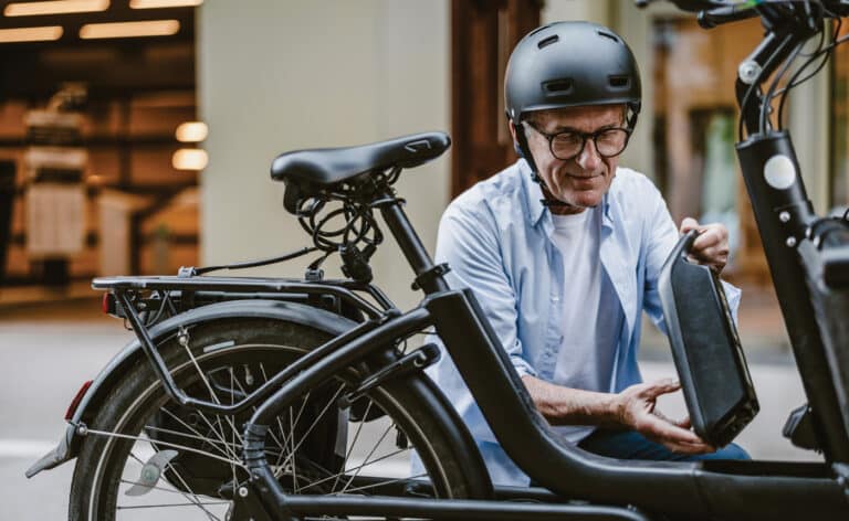 Senior man setting up his E-bike