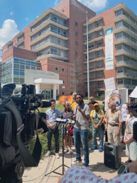 A group of protesters gathers outside of Weiss Memorial Hospital on August 8, 2025