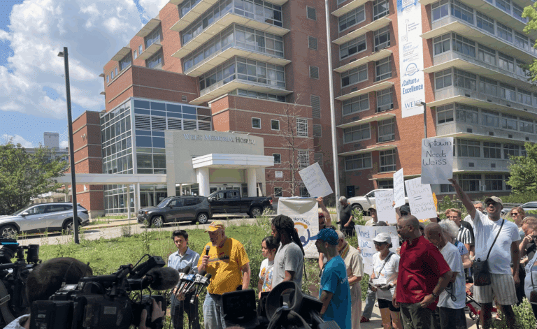 A group of protesters gather outside of Weiss Memorial Hospital on Aug. 8, 2025