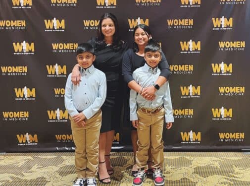 Women In Medicine Founder Shikha Jain, MD, smiles with her children before the summit's Friday night gala.