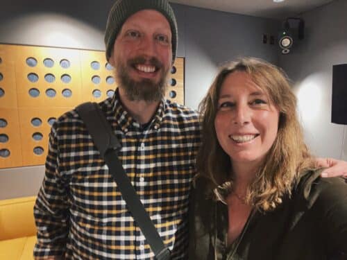 Dan Dean and Katie Scarlett Brandt smile in the Chicago Recording Company studios