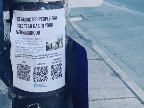 A sign taped to a traffic post in Chicago's Old Irving Park neighborhood alerts community about ICE's use of tear gas nearby.