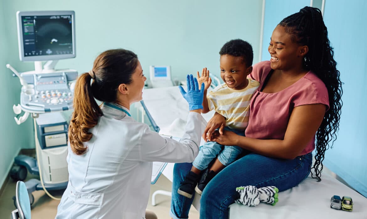 Mother and child at a doctor's visit. How people pay for care is changing. Representing direct primary care and concierge care