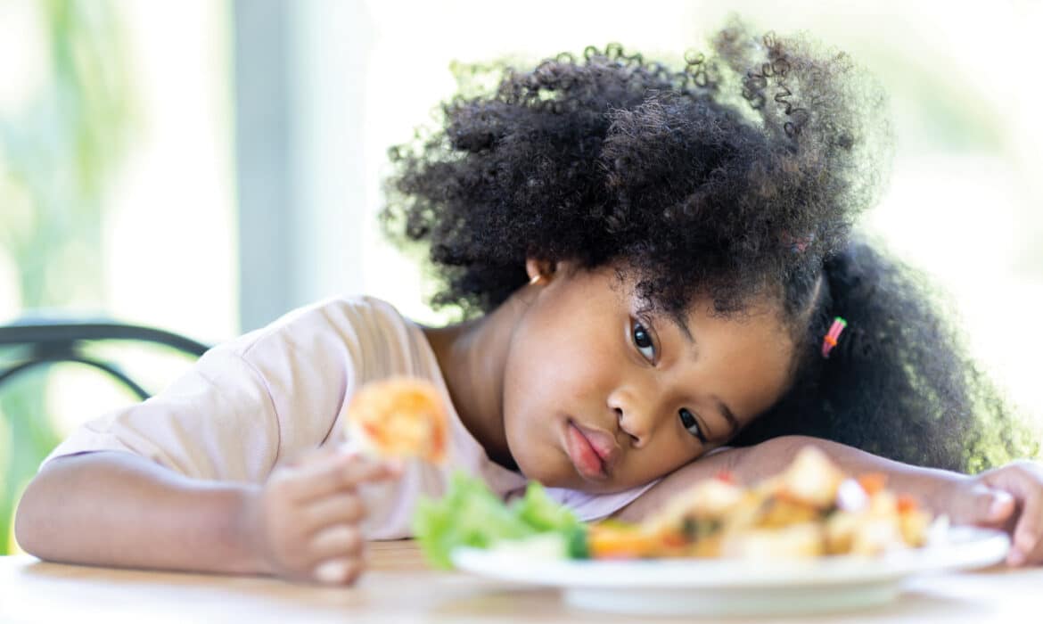 Child not eating her meal representing an eating disorder or being a picky eater. AFRID is one such disorder.