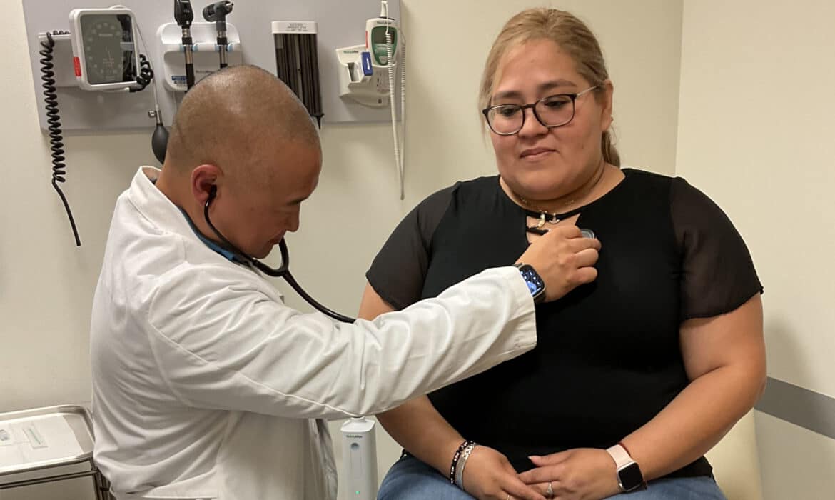 Dr. Simon Kim examines a patient