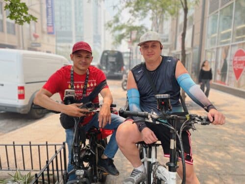 Bike couriers Jason and Kevin wait outside of Jewel-Osco.