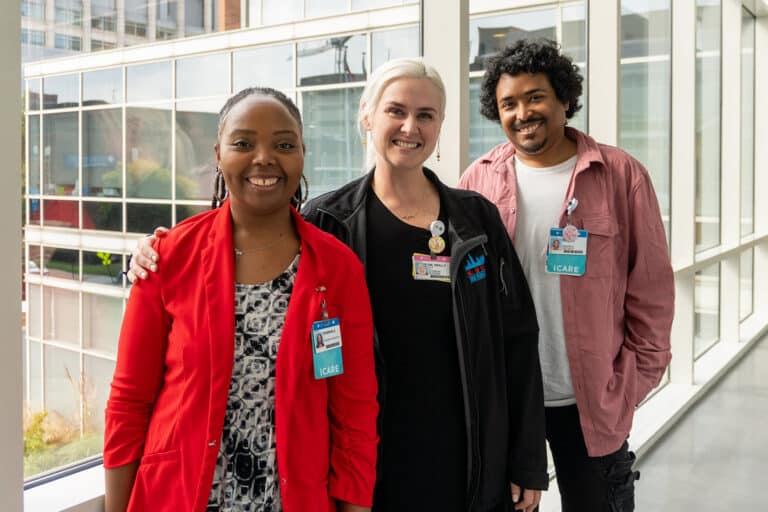Caption: Peer patient advocates Ronisha Edwards-Elliott (left) and Ryan Cooper (right) pose with Paige Reilly, UIC professor of pediatric hematology-oncology in the College of Medicine. The three work at the S.T.A.R. Clinic, guiding adolescents with sickle cell disease.