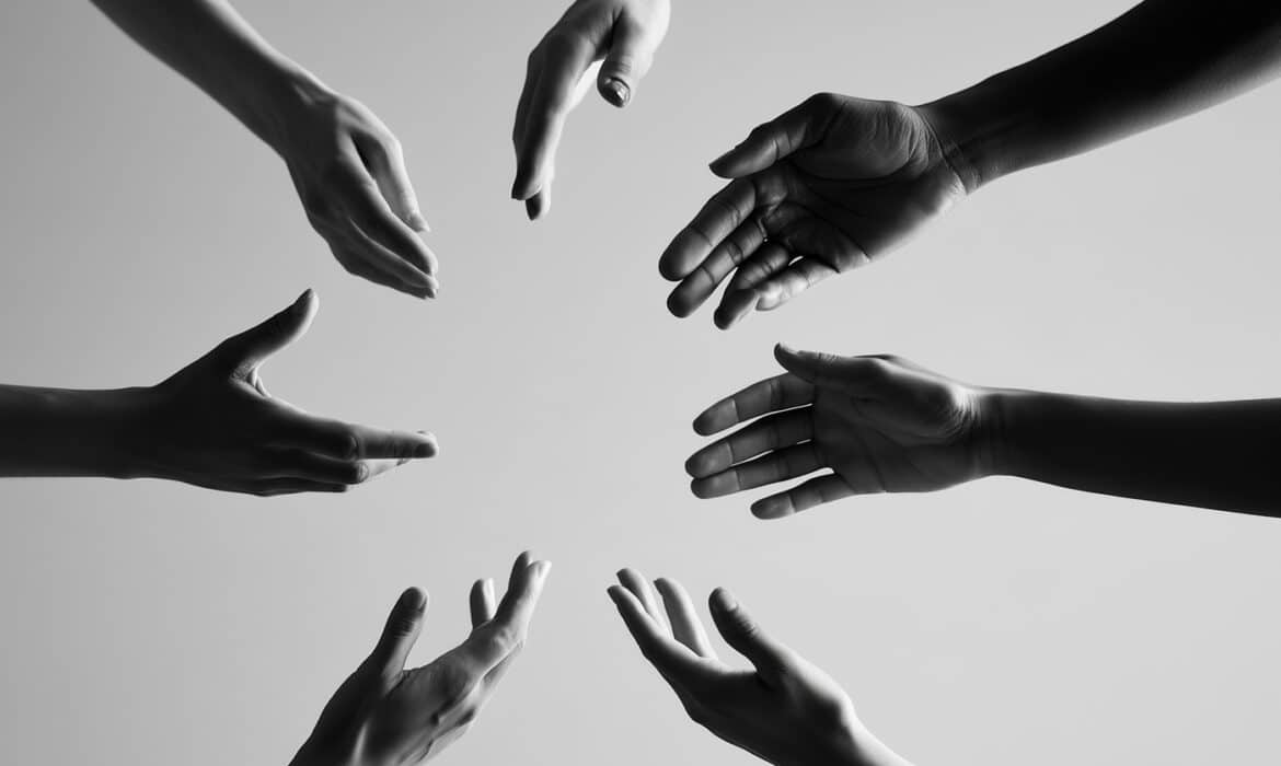 Supportive hands reaching in towards each other