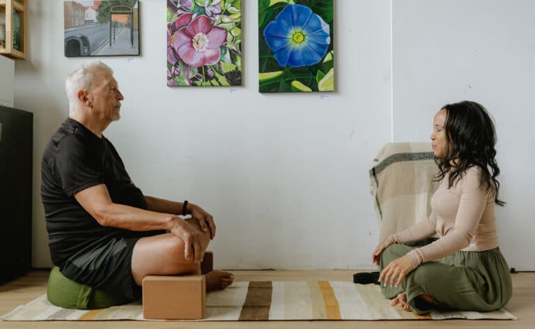 Jaime Lewis, Hospice Medical Director for Loyola Home Care and Hospice and licensed yoga instructor, works with a client. Photos by Jim Vondruska