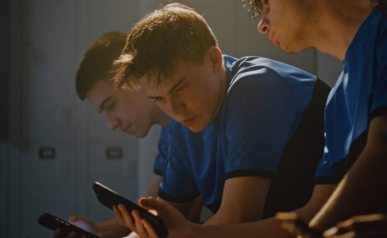Young men looking at their cell phones