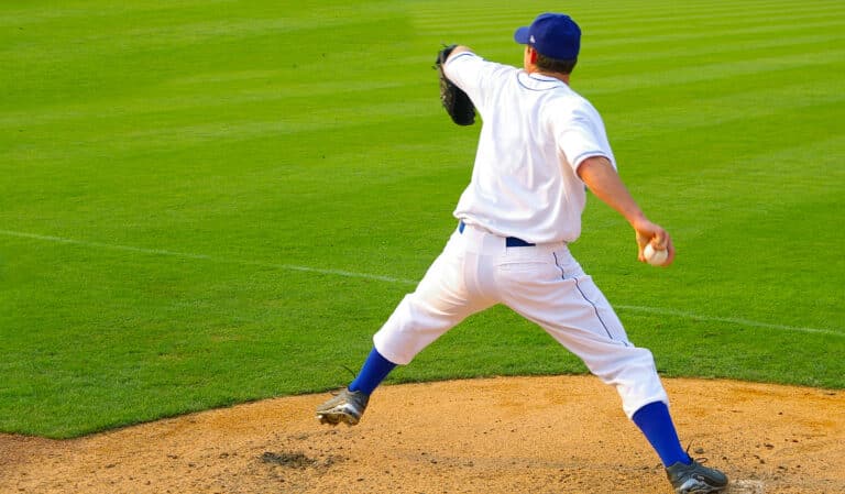 Professional baseball pitcher throwing a fast ball