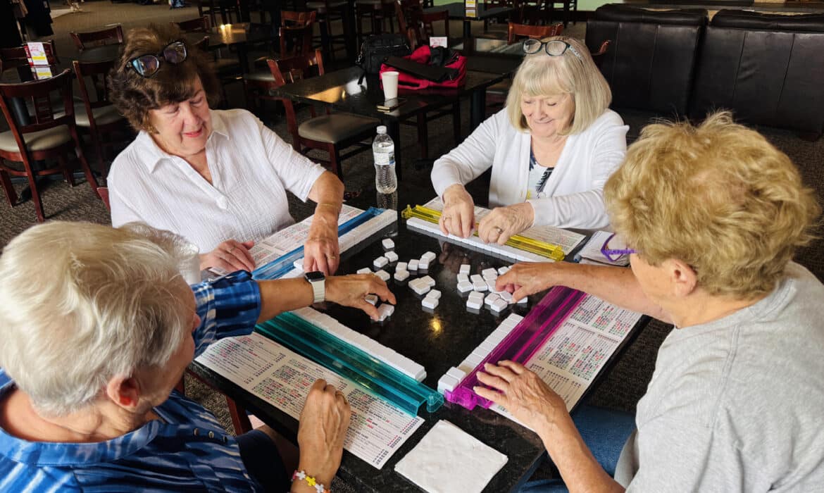 From left: Ruth Stennett, Connie Vanni, Ruth Abbate and Sandy Heinze play mahjong three times a week at the South Barrington Club after their water aerobics classes. Photos by Erin Chan Ding