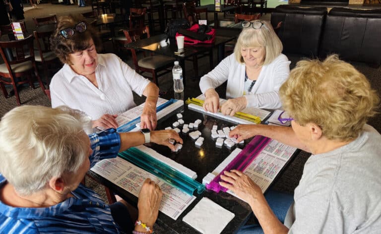 From left: Ruth Stennett, Connie Vanni, Ruth Abbate and Sandy Heinze play mahjong three times a week at the South Barrington Club after their water aerobics classes. Photos by Erin Chan Ding